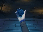 Lehran holding medallion