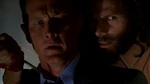 John Doggett is taken hostage by Robert Fassl.jpg