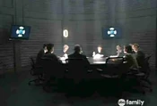 Latnok board members in session to hear report.