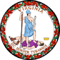 =A circular seal with the words "Virginia" on the top and "Sic Semper Tyrannis" on the bottom. In the center, a woman wearing a blue toga and Athenian helmet stands on the chest of dead man wearing a purple breastplate and skirt. The woman holds a spear and sheathed sword. The man holds a broken chain while his crown lies away from the figures. Orange leaves encircle the seal.