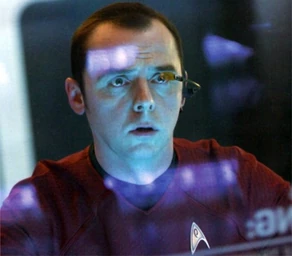 Montgomery Scott (alternate reality) at transporter controls