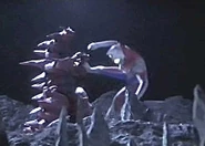 Monsarger battles Ultraman Dyna