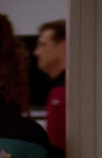 Command division officer in corridor, 2370