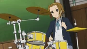 Ritsu playing drums
