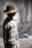Burned zombie and Carl