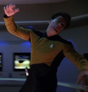 Security officer apprehending Locutus
