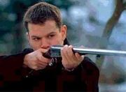 Bourne with a double-barrelled shotgun
