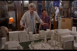 Doc shows Marty his model of downtown Hill Valley.