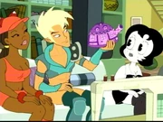 Xandir shows the housemates the tea cozy he knitted.