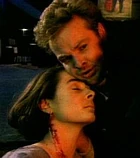 Nick cradles Alyce's unconscious body