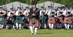 Massed bands at the 2005 Pacific Northwest Highland Games being led onto the field by Drum Major John Nichols
