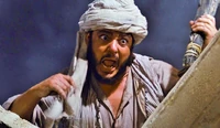 Sallah screaming at a statue of Anubis