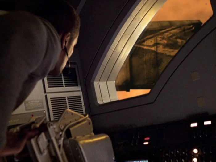 Image:John Kelly observing debris.jpg