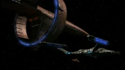 Sh'Raan alongside Enterprise, aft quarter.