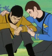 McCoy uses a reader tube to monitor Sulu's recovery.