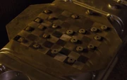 A makeshift checker board with pieces