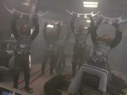 Klingon soldiers raise their bat'leths victoriously