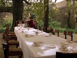 A nightmarish revision of the Mad Tea Party opens up in Mrs. Hargreaves' hotel room