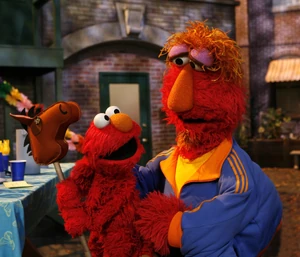 Louie sans-mustache and Elmo, in Talk Listen Connect.