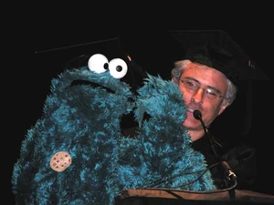 David Rudman performs Cookie Monster at a recent graduation ceremony.
