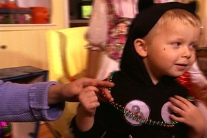 Child dressing for trick or treats in A Magical Halloween Adventure