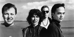 The Pixies early in their careers — Black Francis, Kim Deal, David Lovering, and Joey Santiago.
