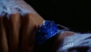 Dax-Ur's blue kryptonite bracelet.