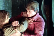 Clark pushes Byron into a dark well.