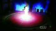 Kara stopping the blast using her body.
