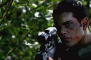 Van prepares to shoot Clark Kent.