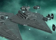 A Victory-class Star Destroyer in an attack formation with an Imperial-class Star Destroyer and TIE series starfighters.