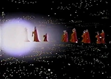 Wookiees, including Chewbacca and his family, approaching the celebration
