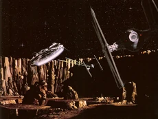 The Millennium Falcon, with TIE Fighters in pursuit.