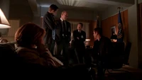 Scully's associates try to devise a way for her to escape