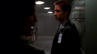 Reyes and Mulder look on
