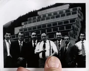 The Cigarette-Smoking Man standing to the far left of his colleagues in a photograph from the early 1970s.